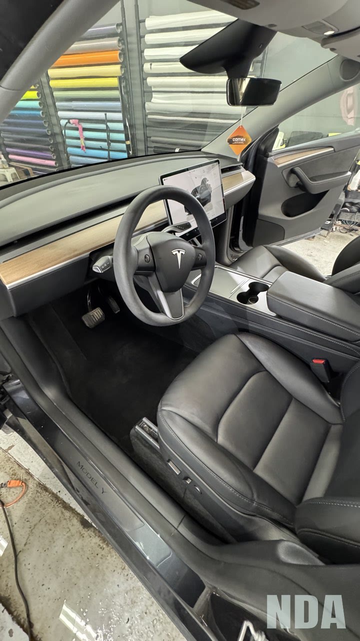 Detailed interior of a dark grey Tesla Model Y