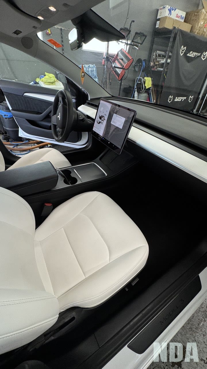 Detailed interior of a dark grey Tesla Model Y