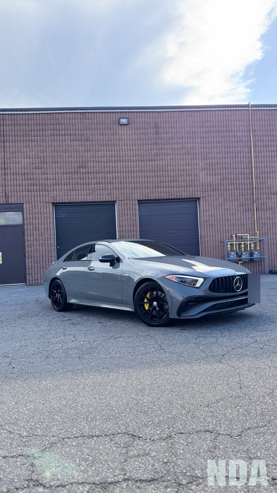 Nardo grey Mercedes-AMG CLS 53 in the wash bay