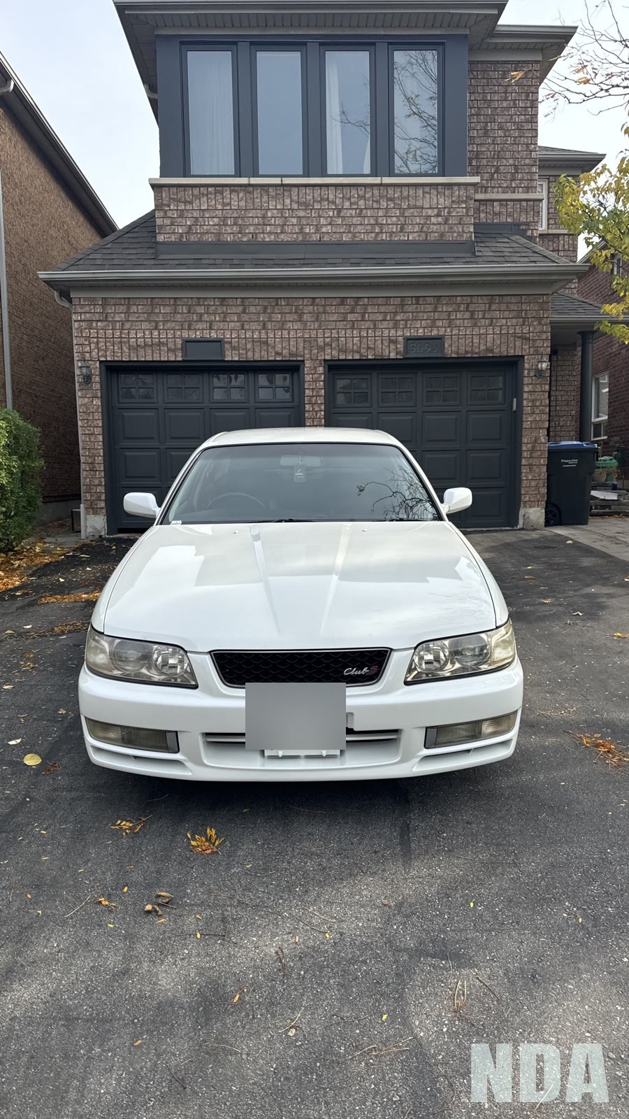 White JDM Nissan Laurel after detailing